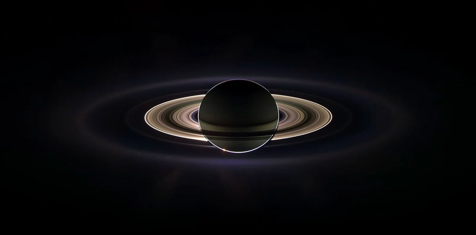 Saturn eclipsing the Sun, its rings lit from behind, photographed by Cassini